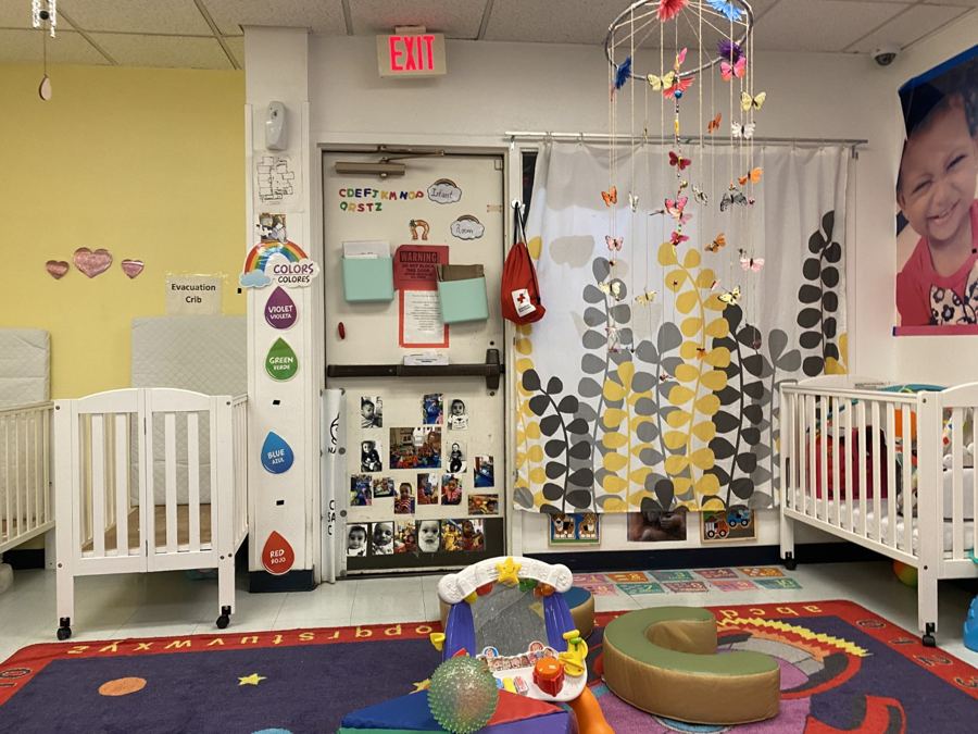 The infant room at Nana’s: cribs, play mats and soft furniture