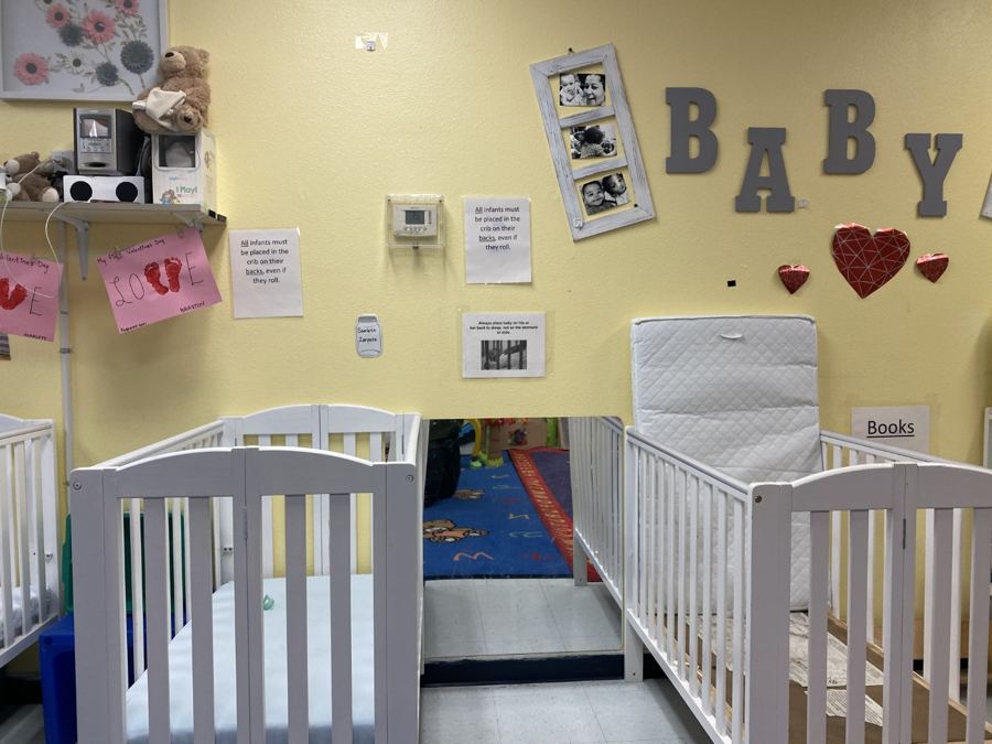The infant room at Nana’s: cribs, play mats and soft furniture