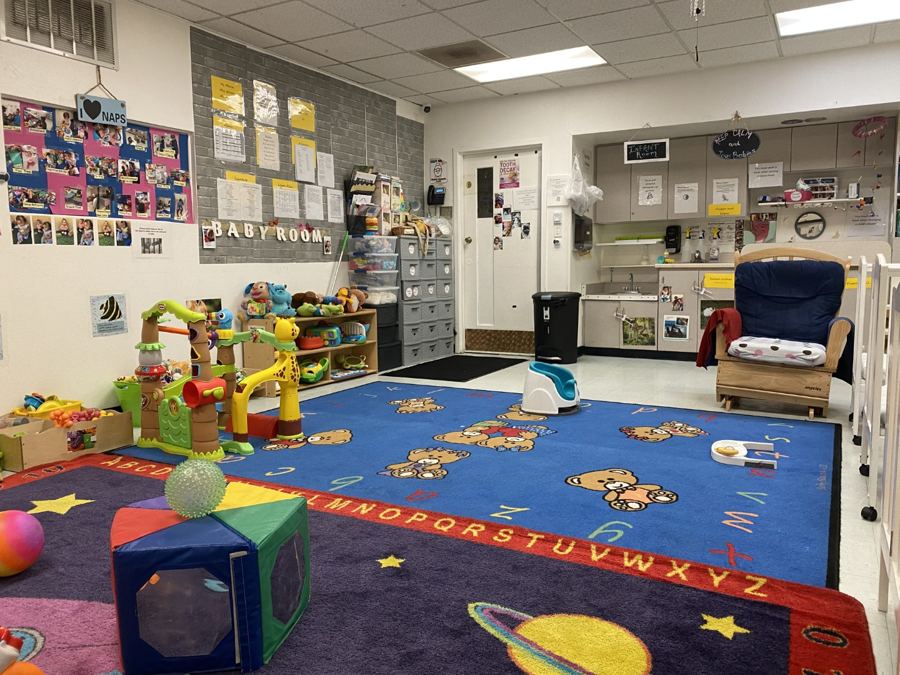 The infant room at Nana’s: cribs, play mats and soft furniture