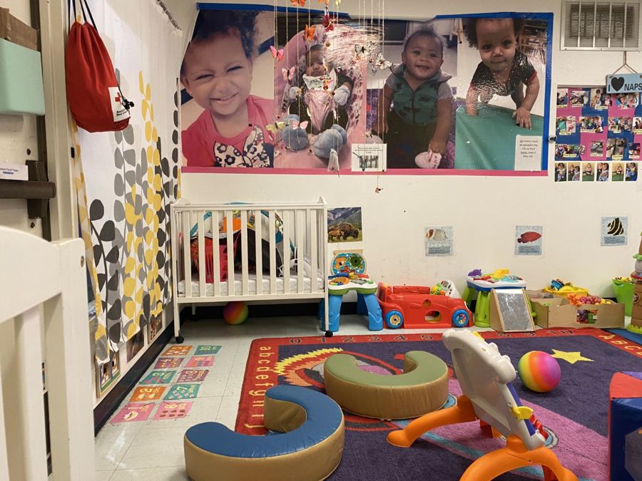 The infant room at Nana’s: cribs, play mats and soft furniture