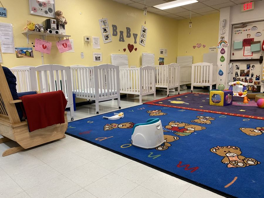 The infant room at Nana’s: cribs, play mats and soft furniture