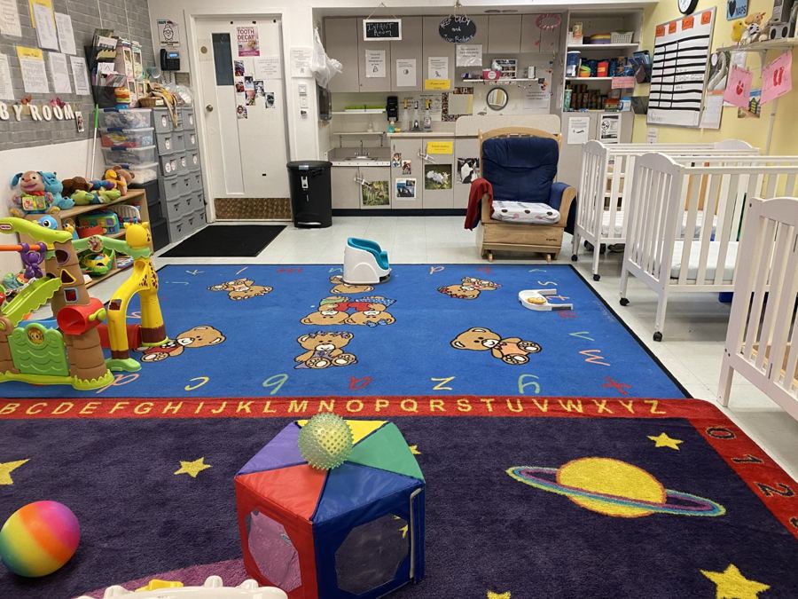 The infant room at Nana’s: cribs, play mats and soft furniture