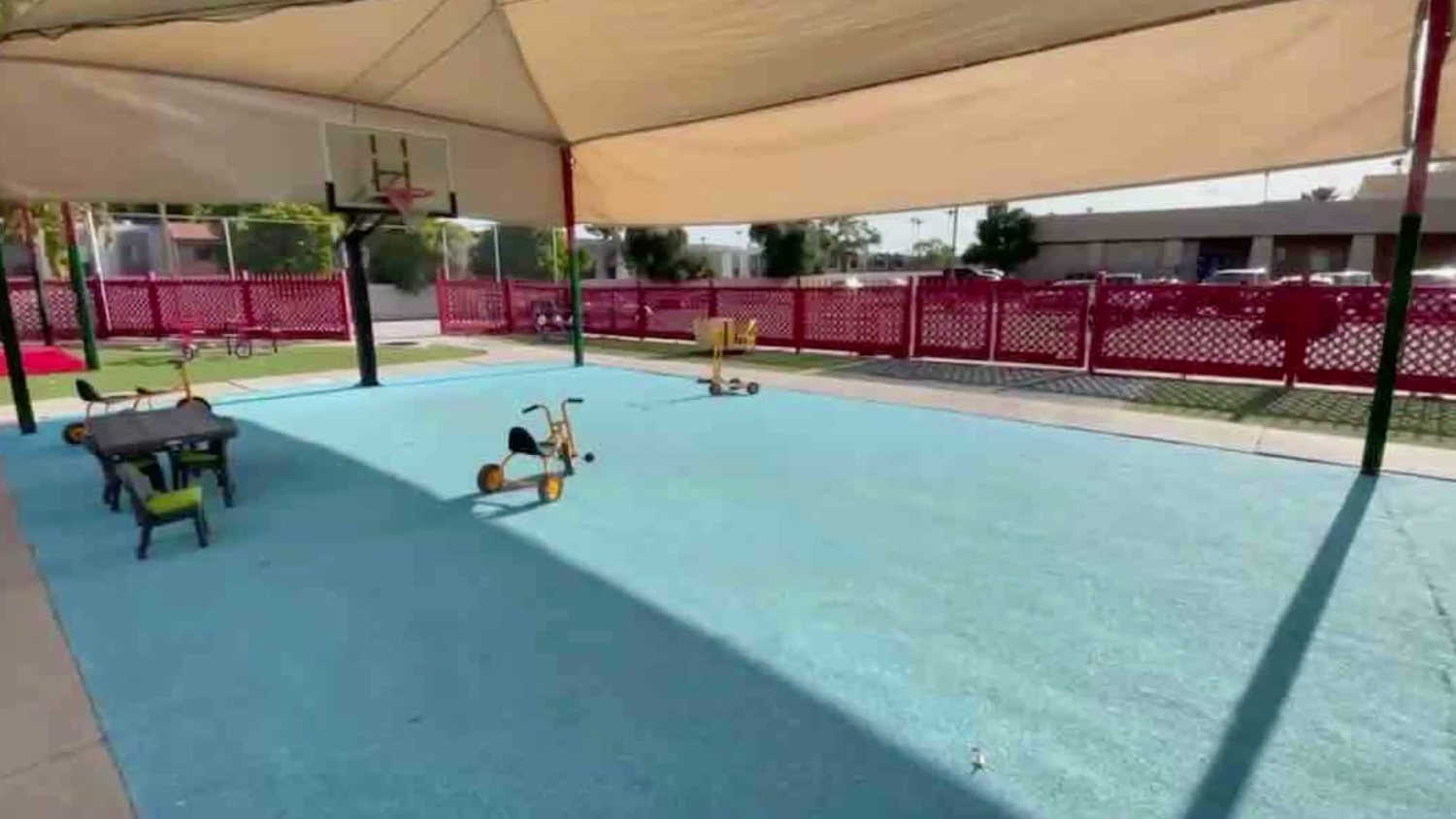 Tricycles on the shaded play court